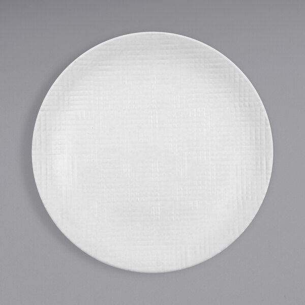 A Cal-Mil Sedona white melamine plate with a textured pattern.