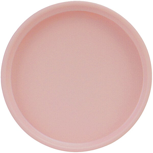 A close-up of a pink Cal-Mil melamine plate with a low rim.