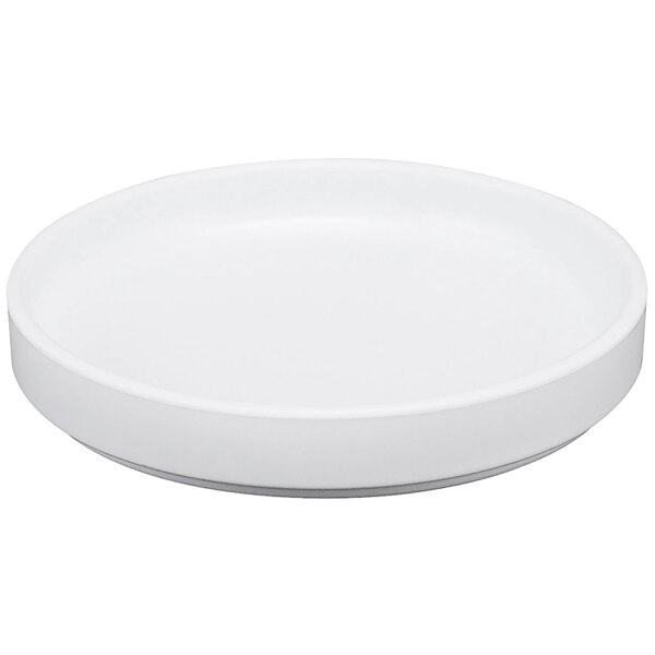 A white Cal-Mil melamine plate with a low rim.