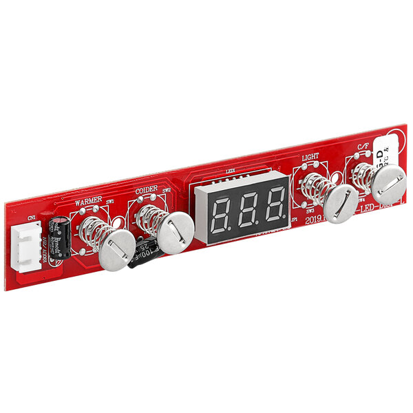 A red circuit board with a digital display.