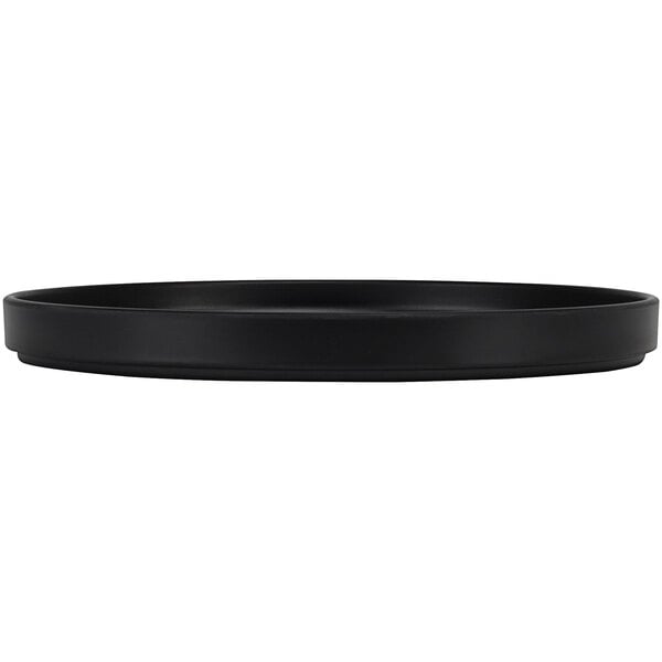 A black round Cal-Mil melamine plate with a white rim.