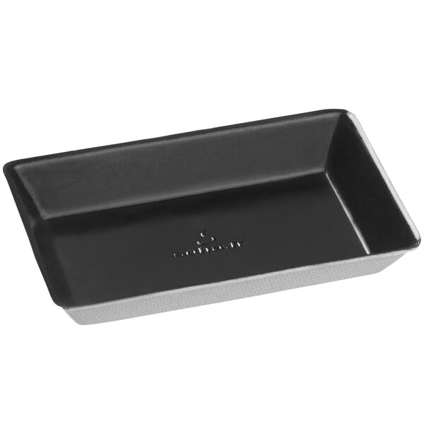 A rectangular black Solia Quartz sugarcane plate with a white lining.