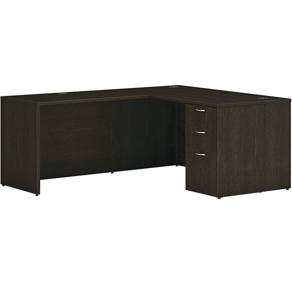A Hon Java Oak laminate L-Station desk with storage pedestal.