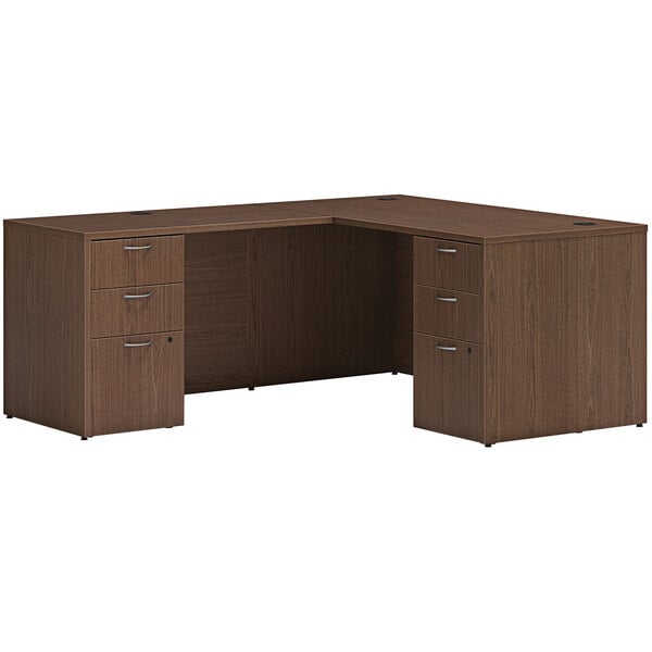 A Hon sepia walnut laminate L-station desk with 2 storage pedestals.