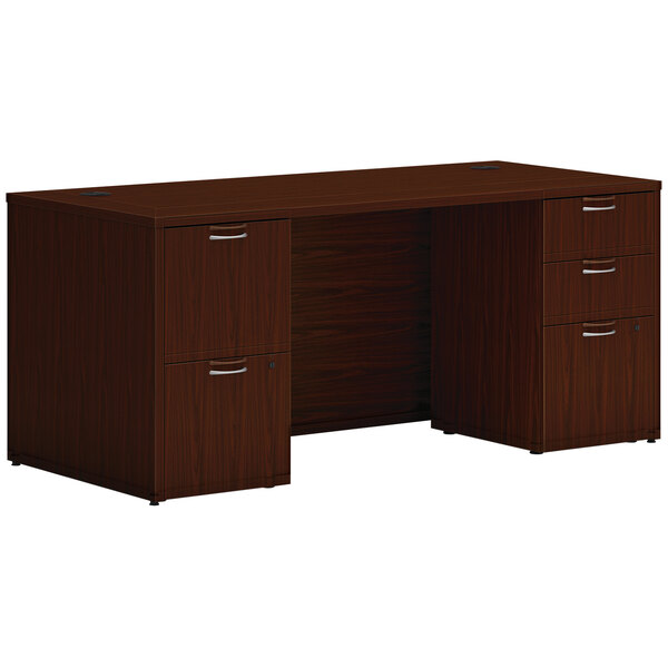 A Hon traditional mahogany desk with 2 storage pedestals.