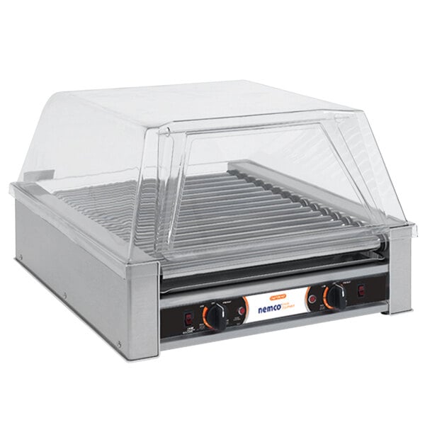 A Nemco hot dog roller grill with a clear cover.