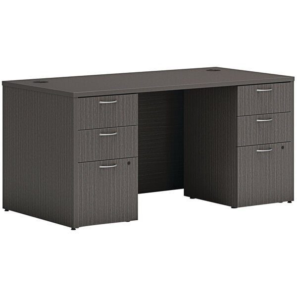 A black Hon Mod laminate desk with two storage pedestals.