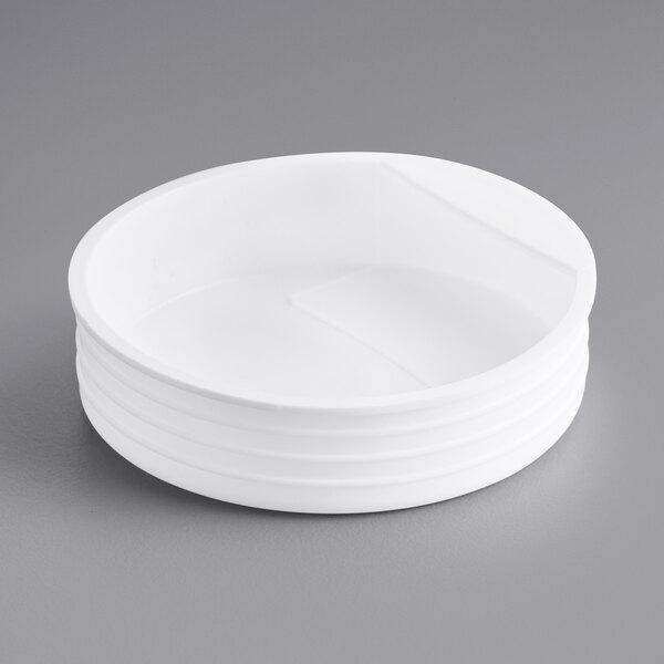 A stack of white plastic end caps.