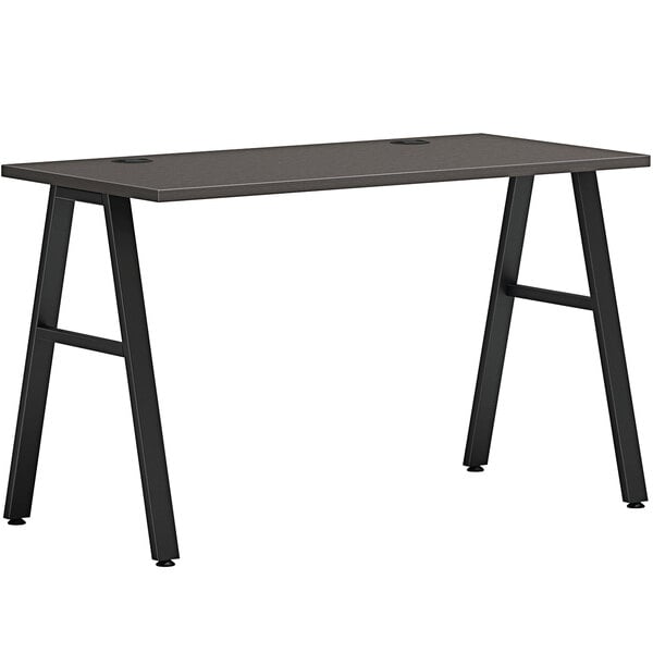 A slate teak laminate Hon desk with black A-legs.