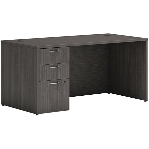 A black Hon Mod desk with storage pedestal.