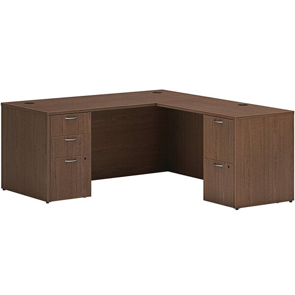 A brown Hon laminate L-station desk with 2 storage pedestals.