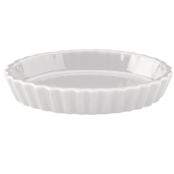 A white bowl with a scalloped edge.