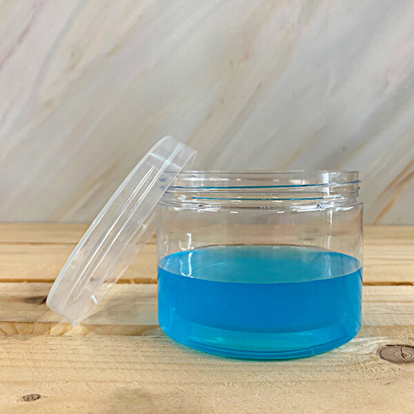 A Solia clear plastic jar with a polypropylene lid containing blue liquid.