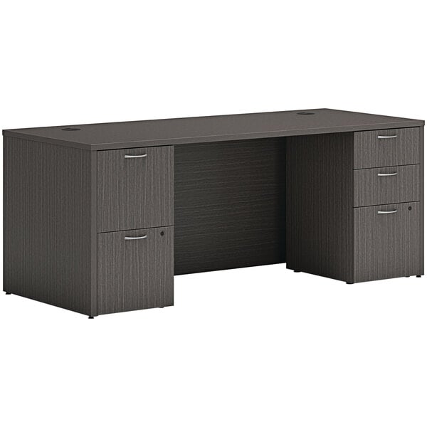 A Hon slate teak laminate desk with 2 storage pedestals.