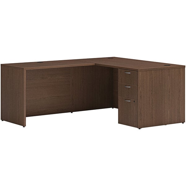 A Hon sepia walnut laminate L-station desk with storage pedestal.