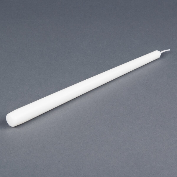 A 12 inch white Will & Baumer taper candle.