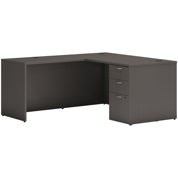A Hon slate teak laminate L-station desk with storage pedestal.