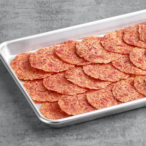 A white tray of Jones Dairy Farm fully cooked round style bacon slices.