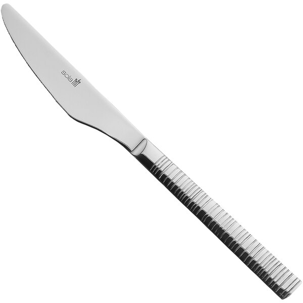 A Sola stainless steel table knife with a black handle and silver blade.