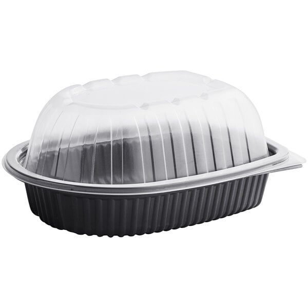 A black plastic D&W Fine Pack chicken roaster container with a clear lid.