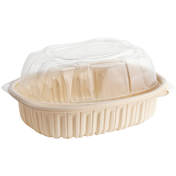 A D&W Fine Pack plastic chicken roaster container with a clear lid.