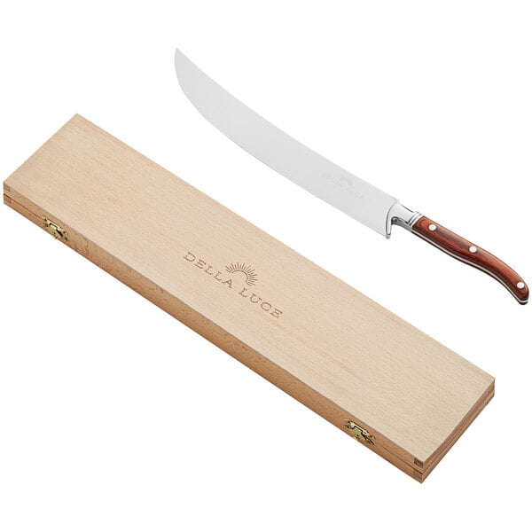A Della Luce Sedona champagne saber with a wooden handle and case.