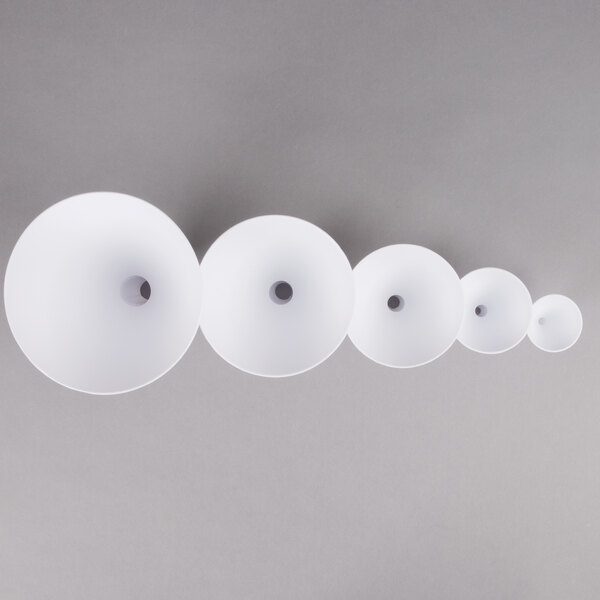 A close-up of a Tablecraft white plastic funnel set
