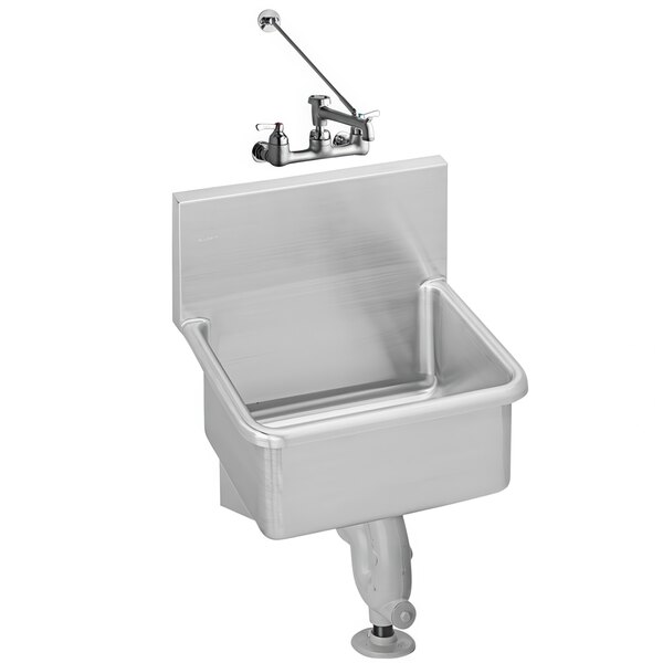A stainless steel Zurn utility sink with a faucet and cast iron P-trap.