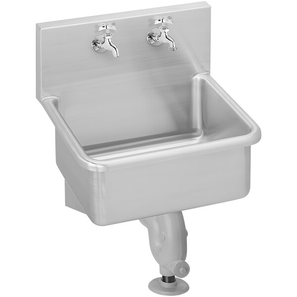 A stainless steel Zurn wall mounted service sink with two faucets.
