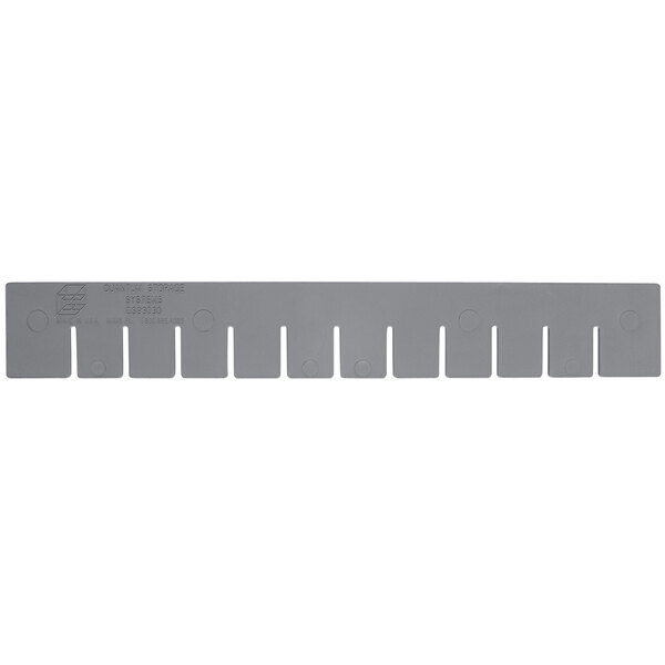 A gray rectangular plastic divider with holes.