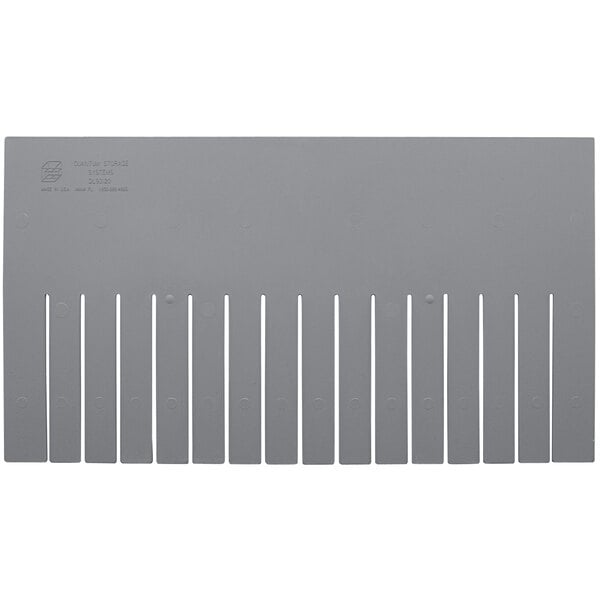 A Quantum gray rectangular plastic divider with rows of holes.