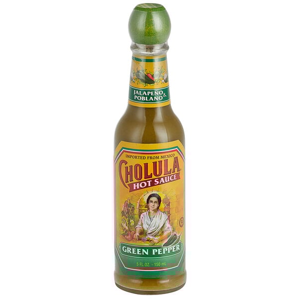 A close up of a 5 oz. bottle of Cholula Green Pepper Hot Sauce with a label.