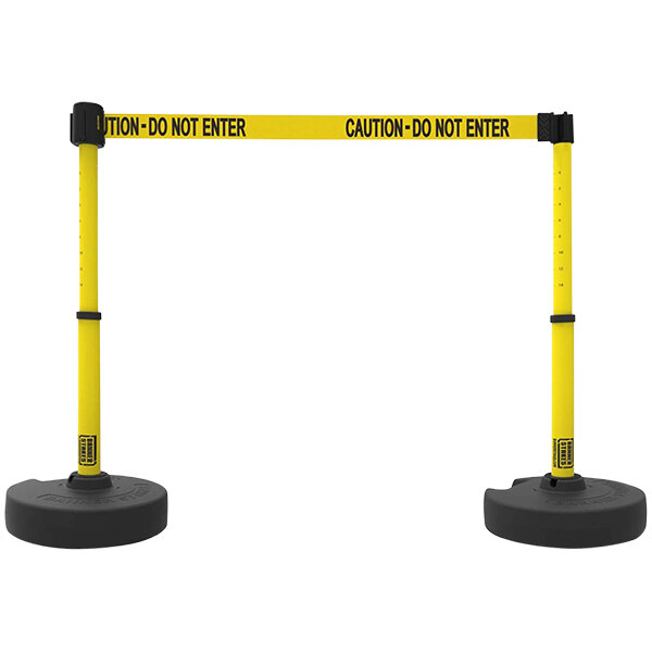 A Banner Stakes yellow and black caution tape barrier on a pole.