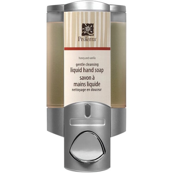 A silver wall-mounted Dispenser Amenities Aviva shower dispenser with a ProTerra label over a translucent bottle of liquid soap.