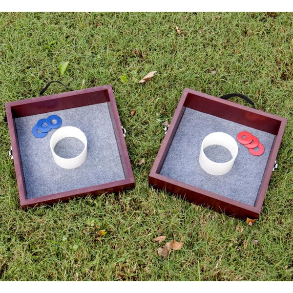 Two square wooden boxes with white circles and red and blue rings on them.