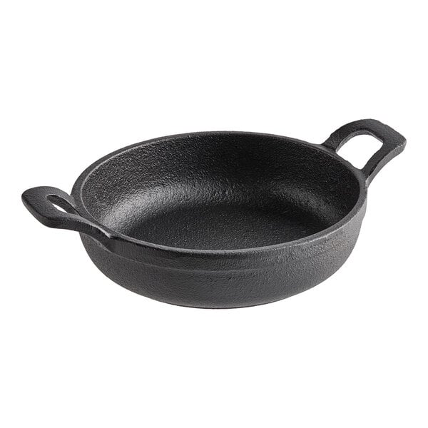 An American Metalcraft pre-seasoned black cast iron round casserole dish with handles.