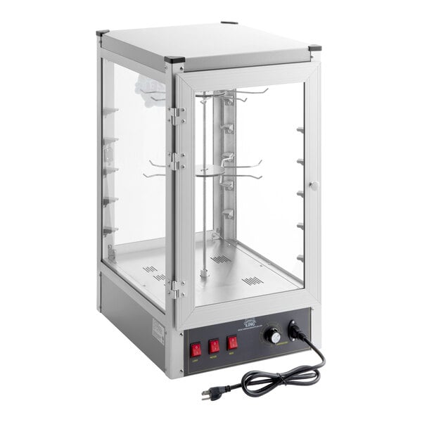 A glass and metal display warmer with a front door, interior rotating racks, control switches, and a power cord.