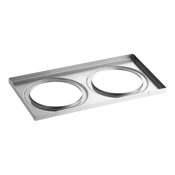 A silver metal plate with two round holes.