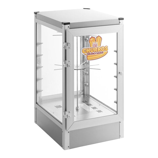 A glass and metal display warmer with a front door, labeled for freshly baked churros, featuring interior racks for holding food items.