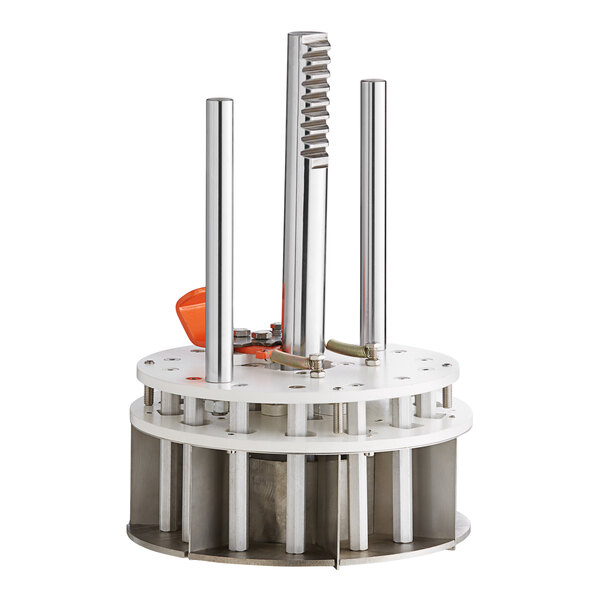 A round white metal Estella dividing head assembly with metal tubes.