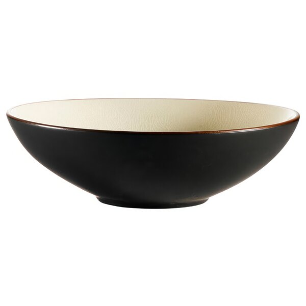 A black bowl with a creamy white rim.
