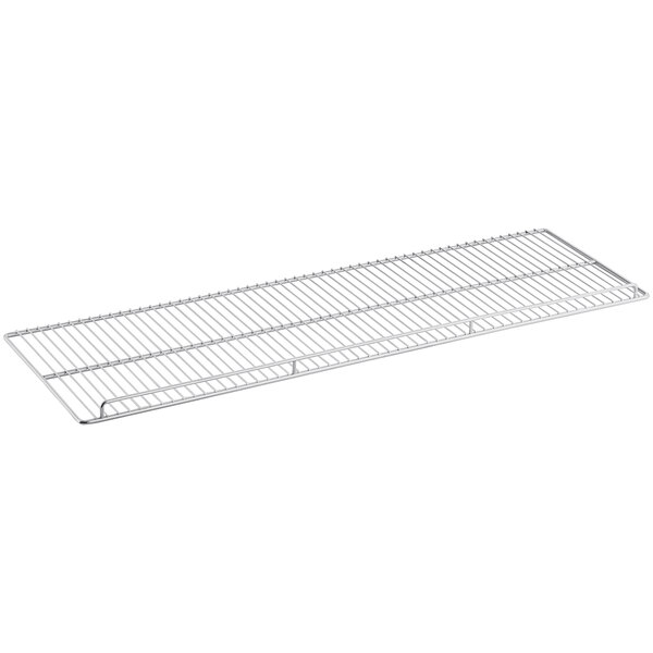 A metal rack on a white shelf.