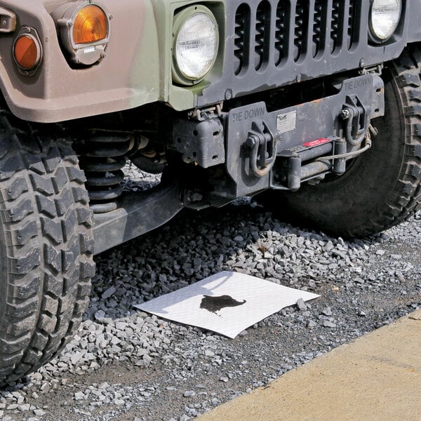A heavy weight absorbent mat pad placed under a vehicle to soak up oil-based liquids.