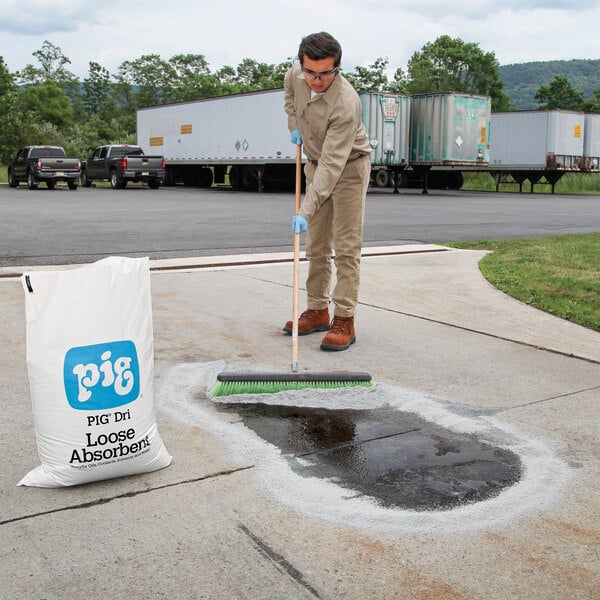 A 40 lb. bag of New Pig Dri loose absorbent used for cleaning up spills on pavement.