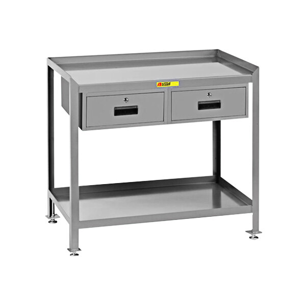 A grey metal work table with drawers.
