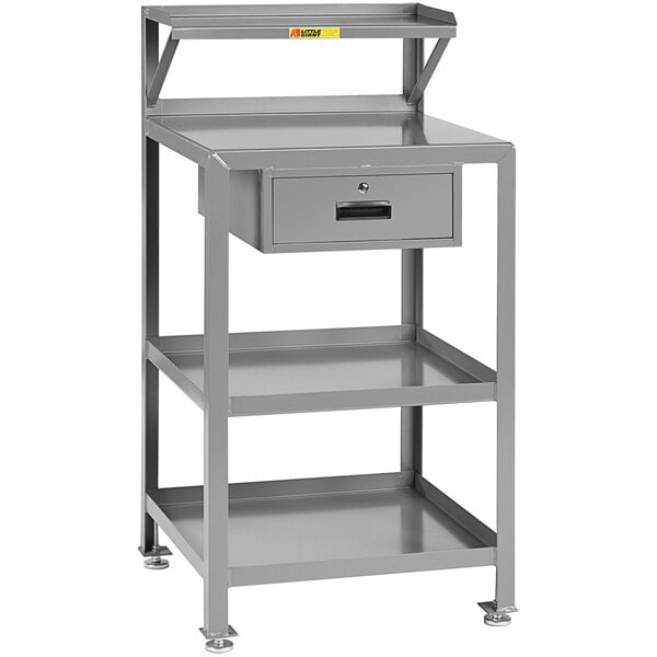 A grey steel shop desk with 3 shelves and a drawer.