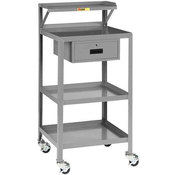 A grey metal Little Giant shop desk cart with a drawer.