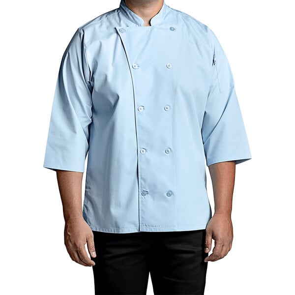 A man wearing a Uncommon Chef sky blue 3/4 sleeve chef coat.