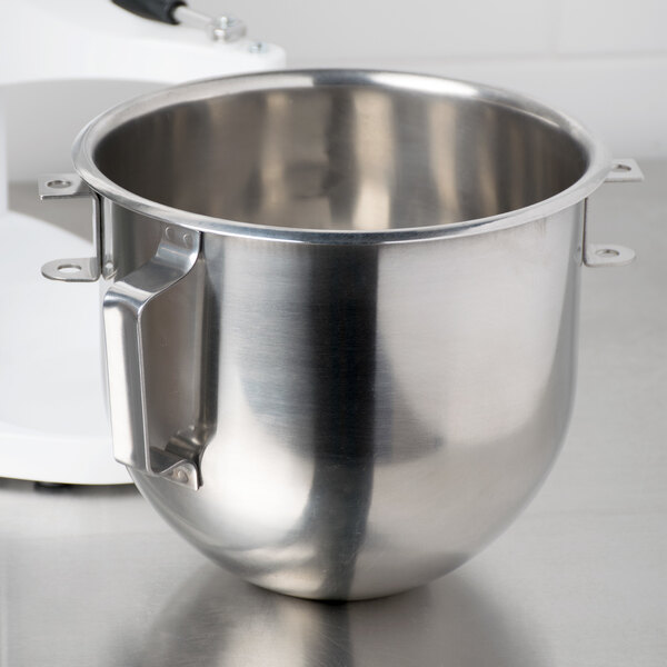A Globe stainless steel mixing bowl on a counter.