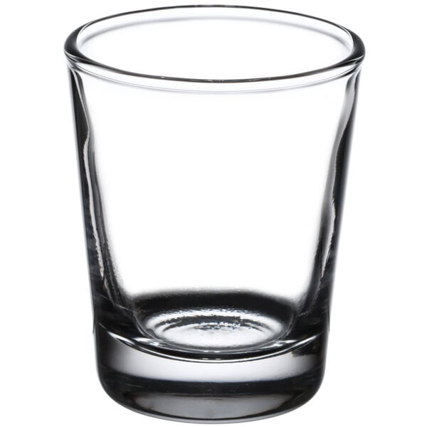 A clear Libbey shot glass on a white background.